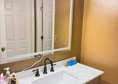 Professionally cleaned residential bathroom vanity and mirror