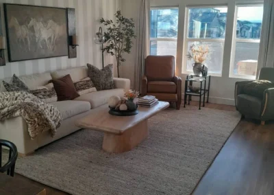 Clean living room with sofa and area rug after cleaning